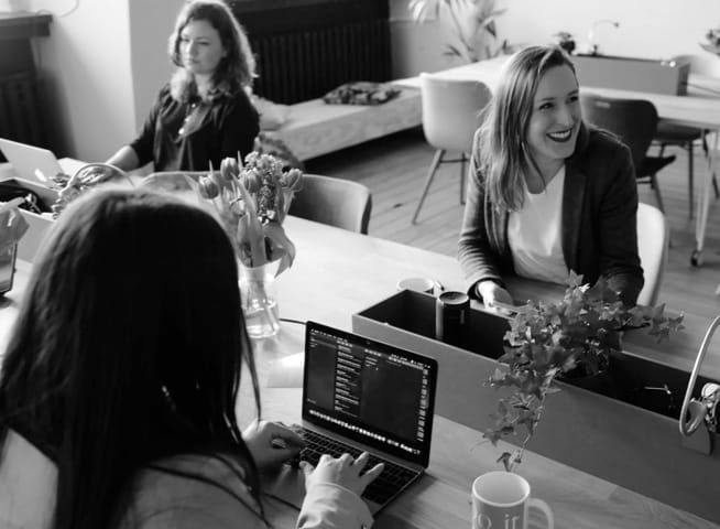 women working and chatting